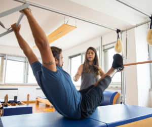 Amputee trains on the Pilates reformer